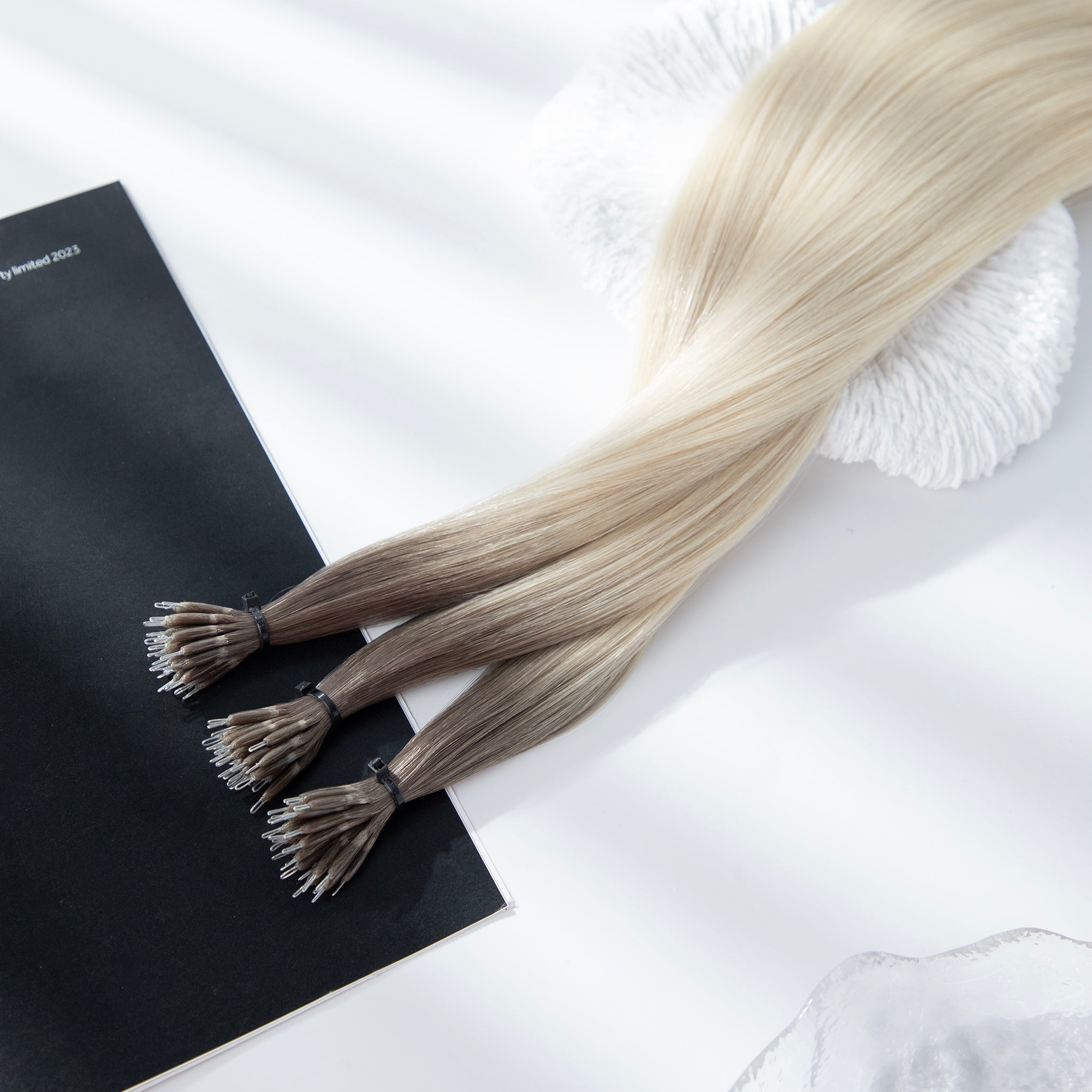 22-inch blonde Russian Remy nano bead hair extensions